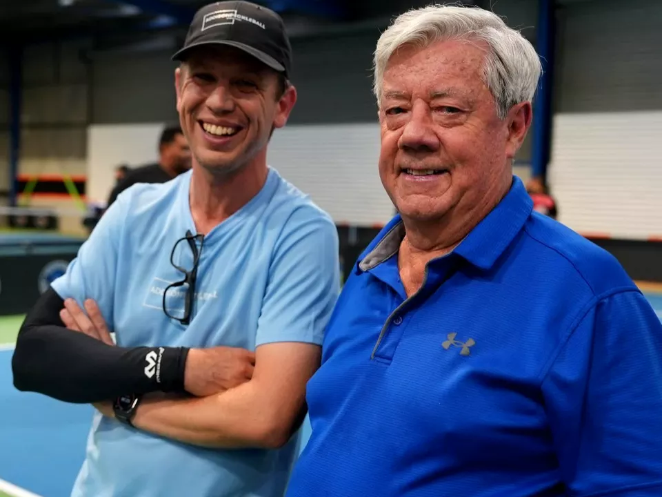 A one-on-one coaching lesson on court